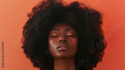 Empowering Portrait of a Fashionable Woman with a Voluminous Afro Hairstyle on a Bold Orange Background