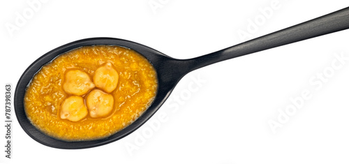 Chickpea cream soup in spoon isolated on white background, top view