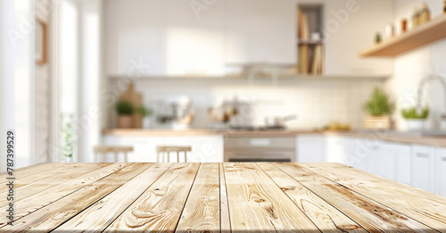 Wooden light empty tabletop against the background of a modern kitchen in light tones, kitchen panel with accessories. Scene showcase template for promotional items, banner, copy space