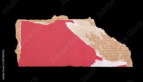 A piece of torn red cardboard on a black background. Torn, crumpled cardboard is used as a background design element.