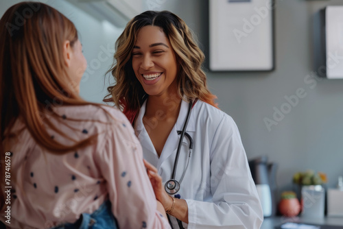 Amiable woman physician engaging with a patient post-examination. The doctor, offers a reassuring smile while gently placing a hand on the patient