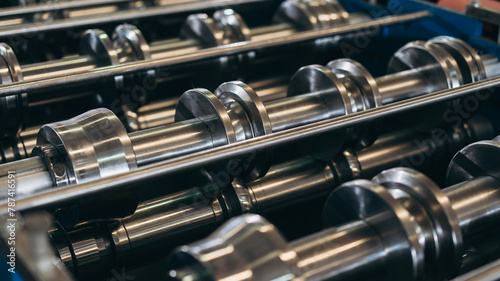 A row of metal cylinders with a metallic sheen