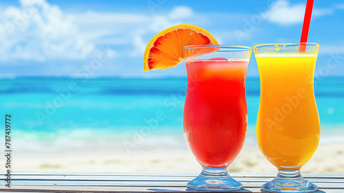 Red berry and orange citrus juice in cocktail glasses on wood table at the beach. Blue sea sky white sand. Bright sunlight. Tropical nature summer vacation concept photo