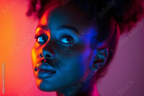 Close-up portrait of a beautiful young girl in neon color, shooting for a fashion magazine