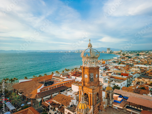 Aerial view of our Lady of Guadalupe church in Puerto Vallarta, Mexico and ocean at golden hour.