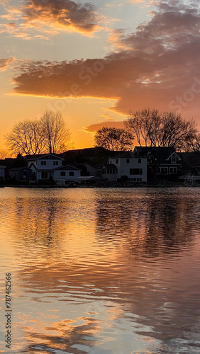 Colorful Sunset Clouds with Water Reflections on River Channel