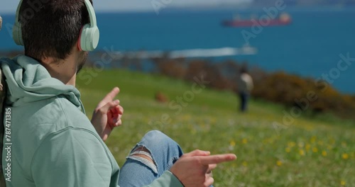 man listening to his favourite song enjoying the landscape photo