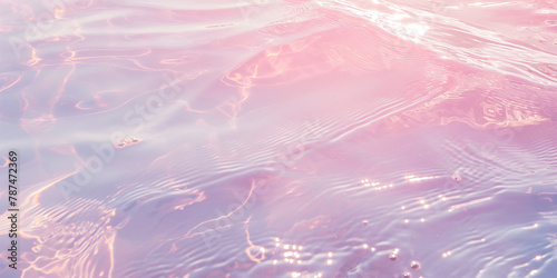 Pink and purple iridescent light on rippling water texture. Design for abstract background, serene wallpaper, peaceful concept.