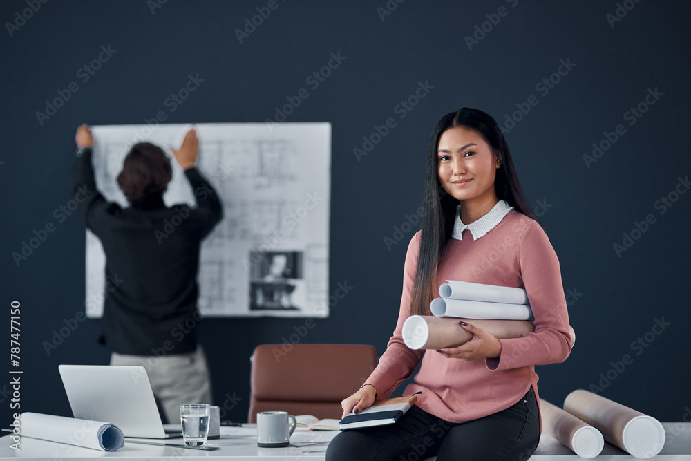 Fototapeta premium Architect, woman and smile in portrait with roll of sketch paper, documents and design project. Person, happy and Asian property developer with blueprint for construction, building or job in Jakarta