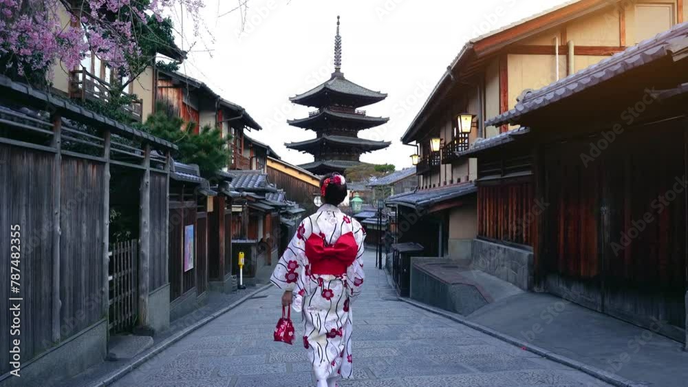 Asian woman wearing japanese traditional kimono at Yasaka Pagoda and Sannen Zaka Street in Kyoto, Japan.