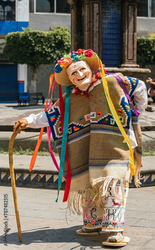 Danza de los viejitos, traditional Mexican dance originating from the state of Michoacan, Mexico. With colorful and lively colors, in addition to his typical old man's mask. photo