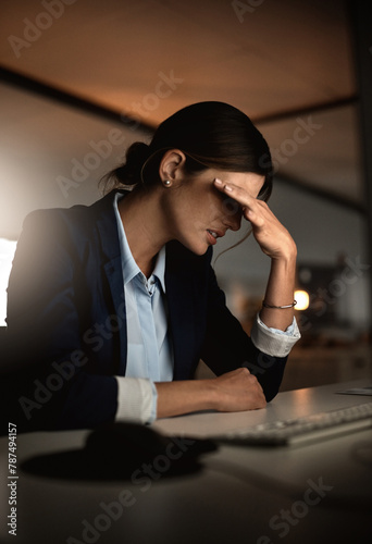 Night, headache and tired businesswoman with stress for migraine pain, burnout risk or depression. Debt, overtime and consultant frustrated by career crisis with mistake, anxiety or fatigue in office