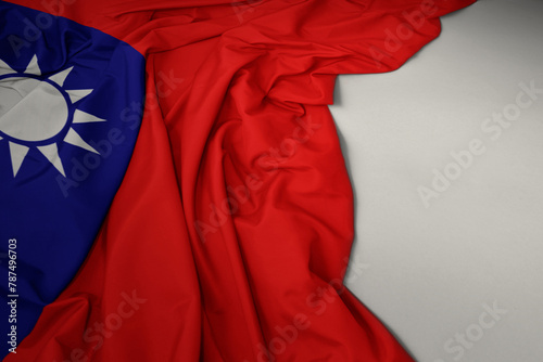waving national flag of taiwan on a gray background. photo