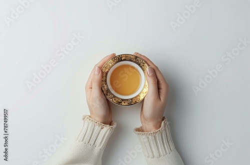 Person Holding Cup of Tea