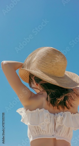 Woman in Bikini and Hat on Beach