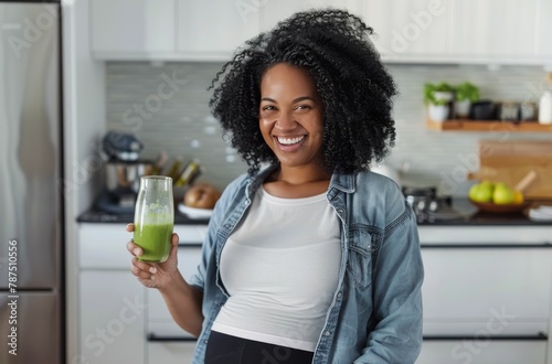 Pregnant Woman Holding Green Smoothie in Kitchen