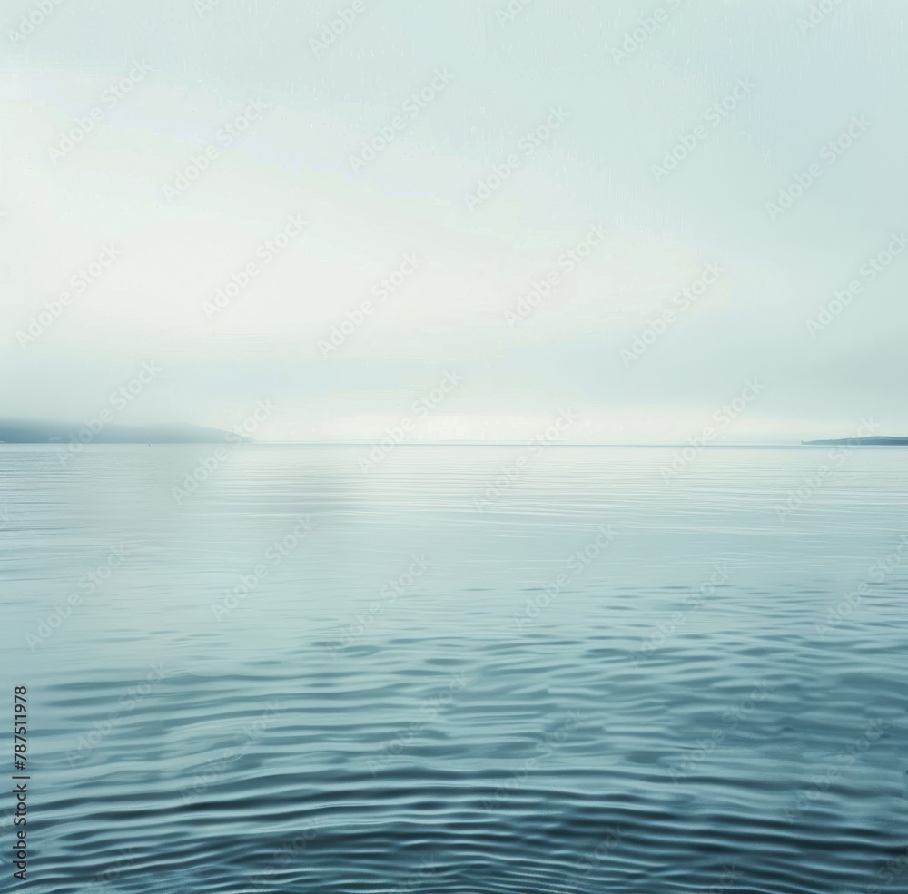 Large Body of Water Under a Cloudy Sky