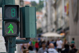 Green traffic light for pedestrians counting down in 8 seconds in Lisbon