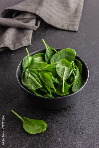 Fresh green spinach leaves in the bowl. Natural vegetarian food.