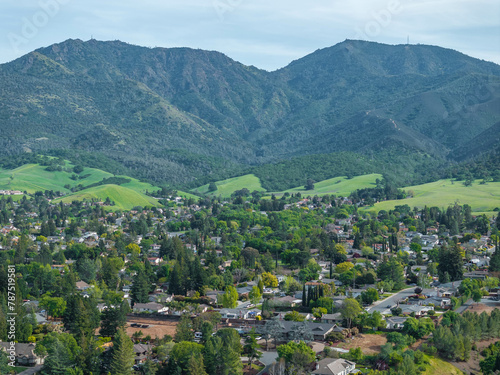 Drone landscape photos over the beautiful landscape of Clayton  California with homes  streets and green hills.