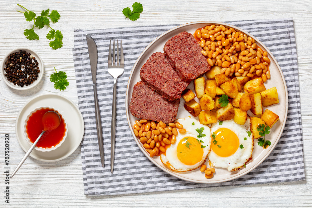 corned beef, baked beans, potatoes and fried eggs corned beef, baked beans, potatoes and fried eggs