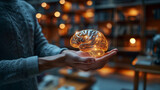 Lumière de la Connaissance : Illustration d'un Cerveau Lumineux dans la Paume d'une Main