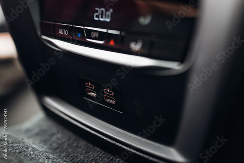Climate control panel in modern car. Knobs and dashboard panel  photo