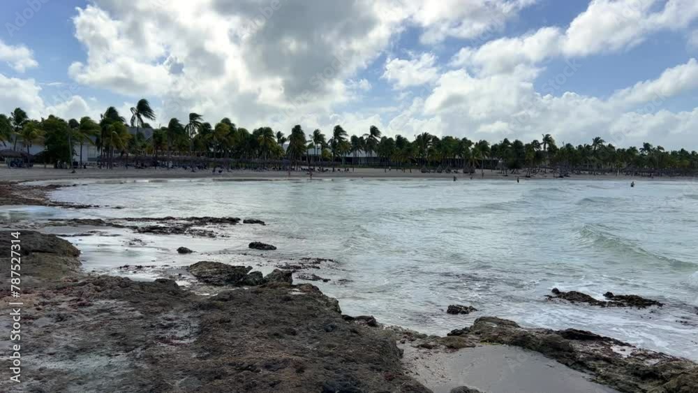 Rocky Cuban beach in Varadero, Cuba, on a cloudy day, when the sun ...