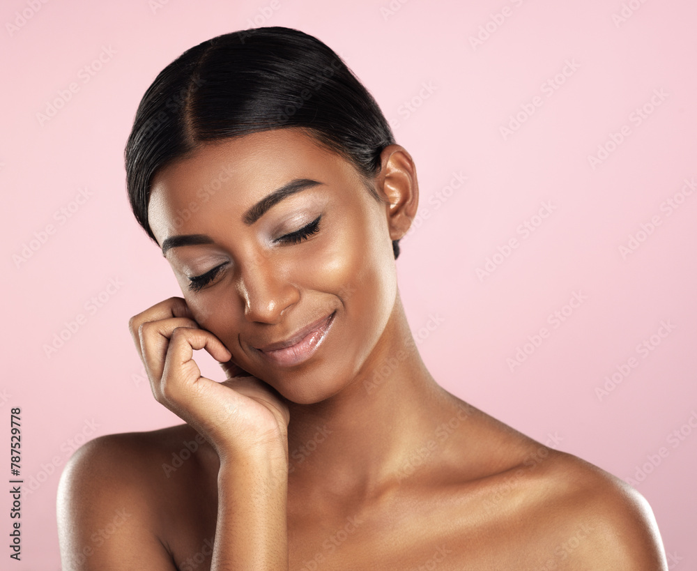 Beauty, face and smile with natural Indian woman in studio isolated on pink background for cosmetics. Aesthetic, eyes closed and skincare with perfect young model at salon or spa for cosmetics