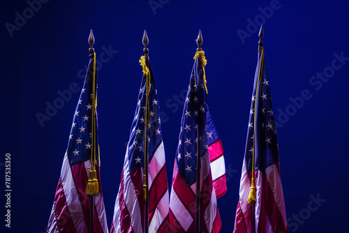 beauty and symbolism of American flags against a deep blue backdrop, commemorating the bravery and dedication of veterans on Veterans Day, Labor Day, and Independence Day.