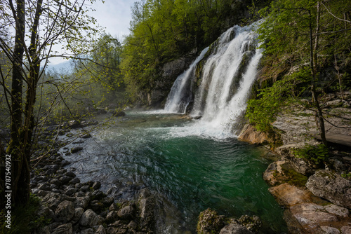 Bovec  Slovenia. Visje waterfalls. Nature trail crystal clear  turquoise water. easy trekking  nature experience  wood path. Waterfalls inside a forest  long photographic exposure  power of nature.