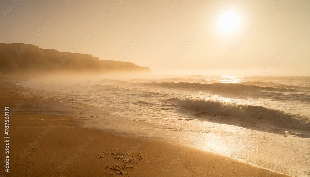 Misty morning over Mediterranean sea. Soft golden sunlight, silky sandy beach, breeze blowing. 