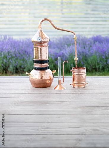 Distillation of lavender essential oil and hydrolate. Copper alambik for the flowering field. © Kotkoa