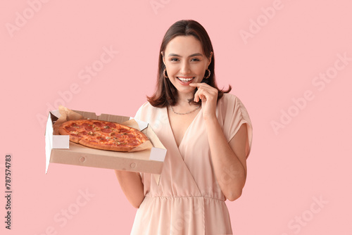 Young woman holding cardboa...