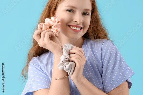 Young redhead woman with sc...