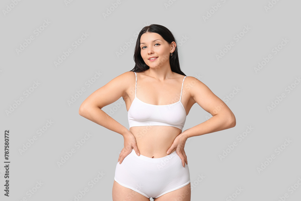 Body positive woman in underwear on light background Body positive woman in underwear on light background