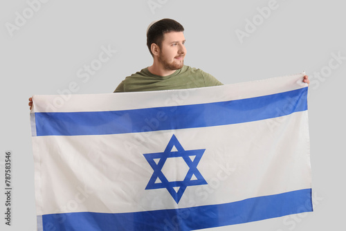 Young Jewish man with flag ...