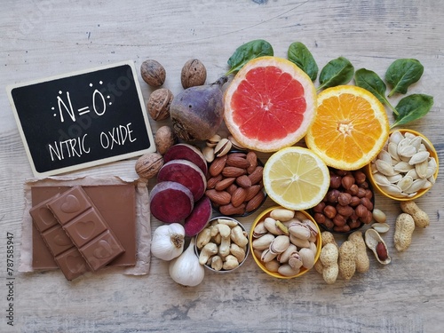 Foods to increase nitric oxide level naturally. Nitric oxide boosting superfoods for optimal health. Nitric oxide rich food with chemical formula of nitric oxide. Fruit and vegetable high in nitrates.