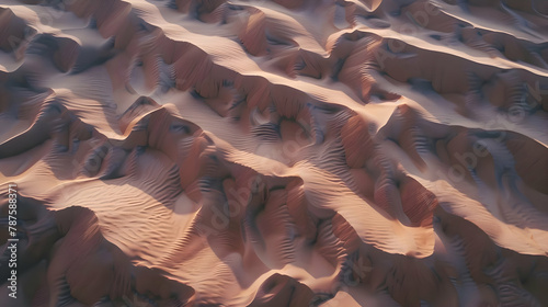 Sand dunes in the early morning light showing delicate patterns, aerial shot to capture the texture and shadow play