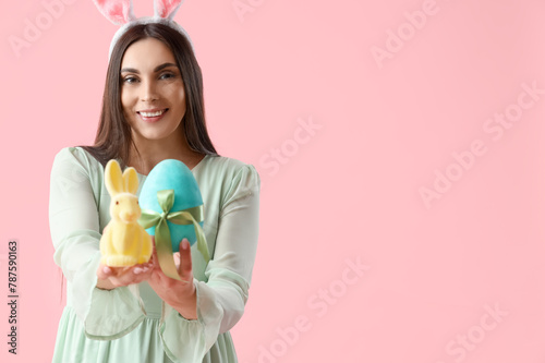 Young woman in bunny ears w...