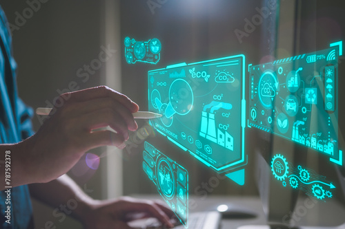 Man hand using computer and pen with virtual modern reduce co2 emission concept with icons global warming emissions carbon footprint climate change to limit global warming energy