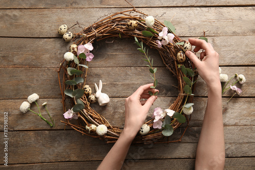 Woman making Easter wreath ...