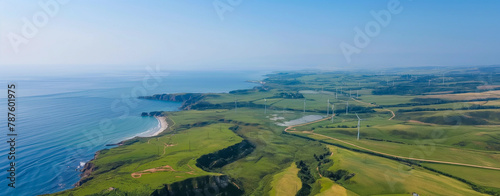 Aerial View of Wind Turbines on Rolling Hills by the Coast with Copy Space © julia_aldo