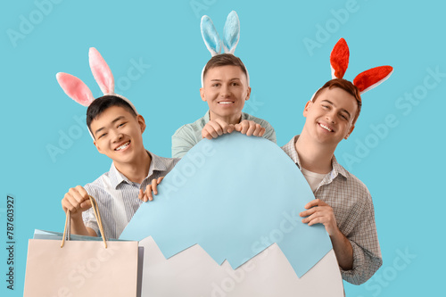 Young men in bunny ears wit...