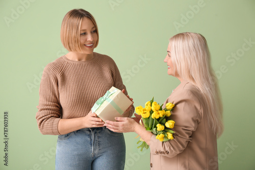 Adult woman greeting her mo...