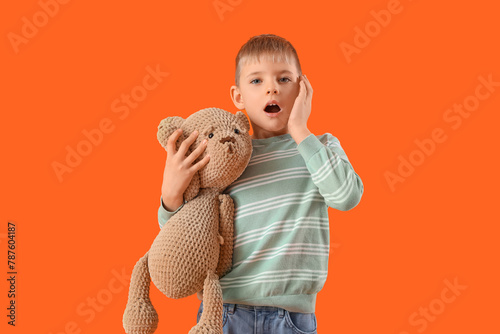 Shocked little boy with ted...
