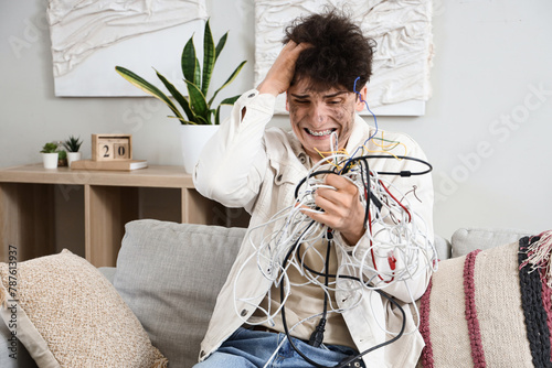 фотографія Electrocuted young man with burn face and wires at home