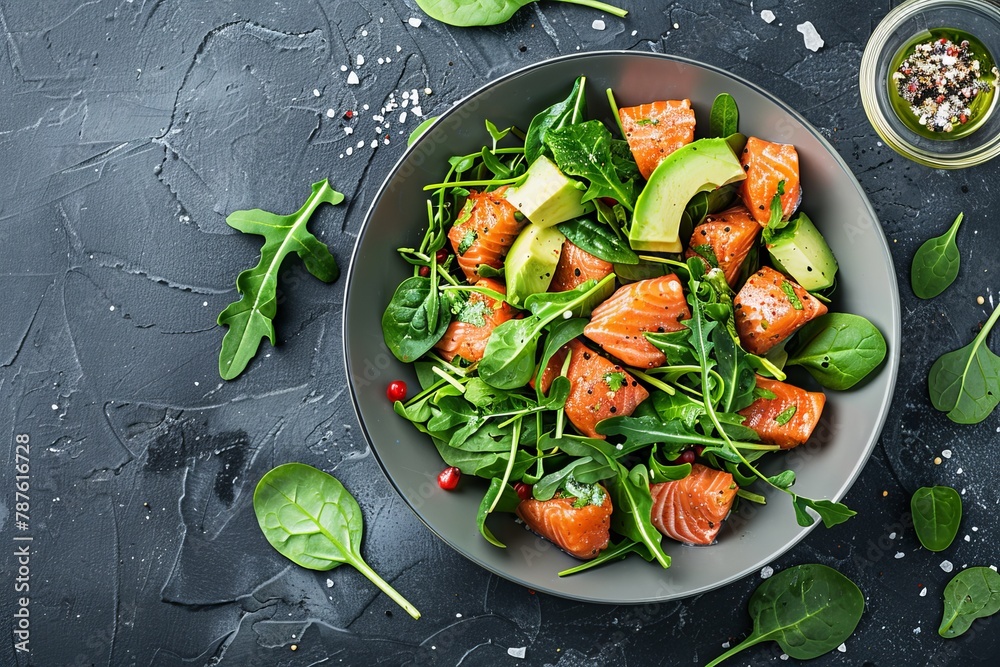 Salmon salad with greens and avocado flat lay