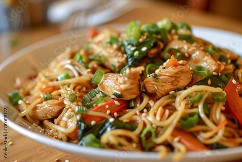 Spicy Thai chicken noodles with sesame seeds photo