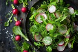 Summer fennel salad with pea shoots and radishes viewed from above